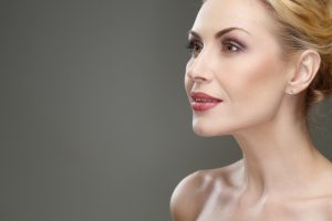 Middle aged woman has smooth neck contours despite her age