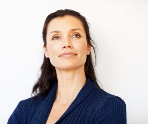Woman in her late 40s has refreshed face with eyelid surgery.