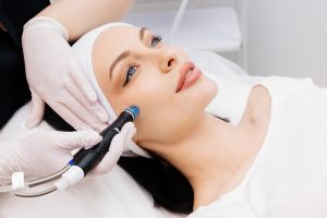 Woman has glowing radiant skin with non-invasive treatments to tackle early signs of aging.