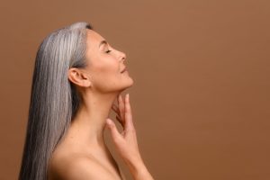 Asian woman in Long Island shows off her smooth neck contours.