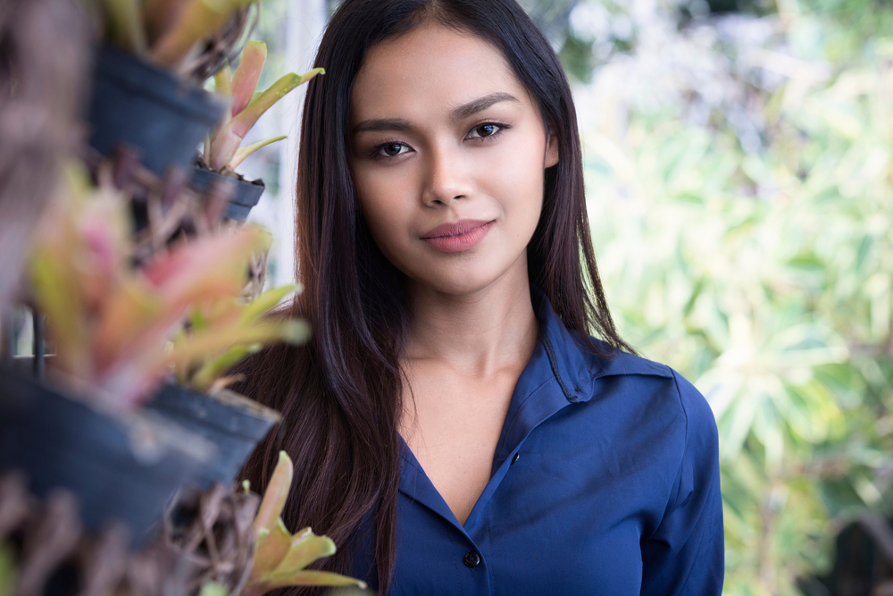 Transgender model smiles outdoors after recovering from her FFS procedures