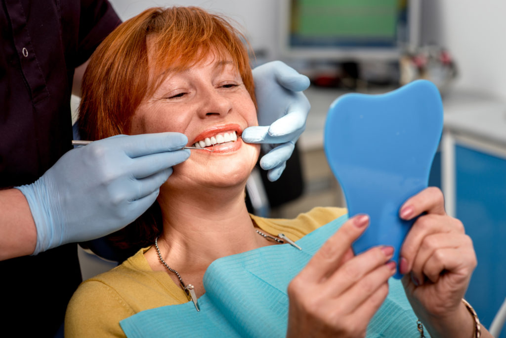 Dentist working on Dentures for a Patient