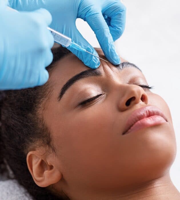 Plastic,Surgery.,Young,African,Woman,Receiving,Botox,Injection,In,Interbrow