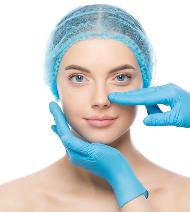 Young,Woman,Ready,For,Rhinoplasty,,Doctor,In,Blue,Gloves,Touching