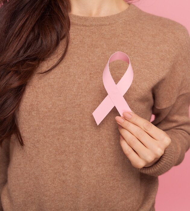 Female,Health,Check,Awareness.,Closeup,Of,Young,Woman,In,Pullover