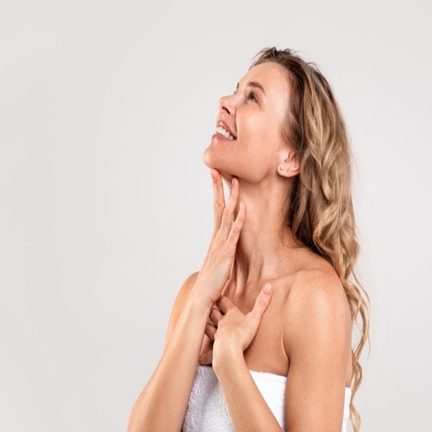 Woman enjoys her new chin following Kybella injections to eliminate excess submental fat