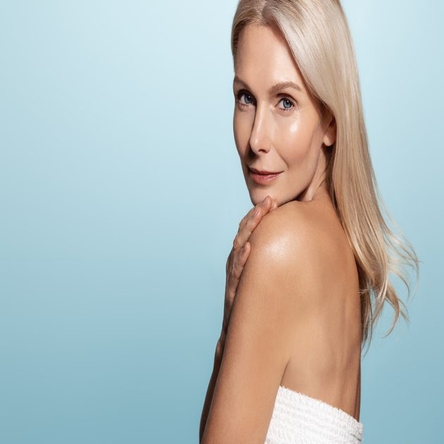 Mature older woman glowing after improving her G-spot sensitivity with an injectable treatment
