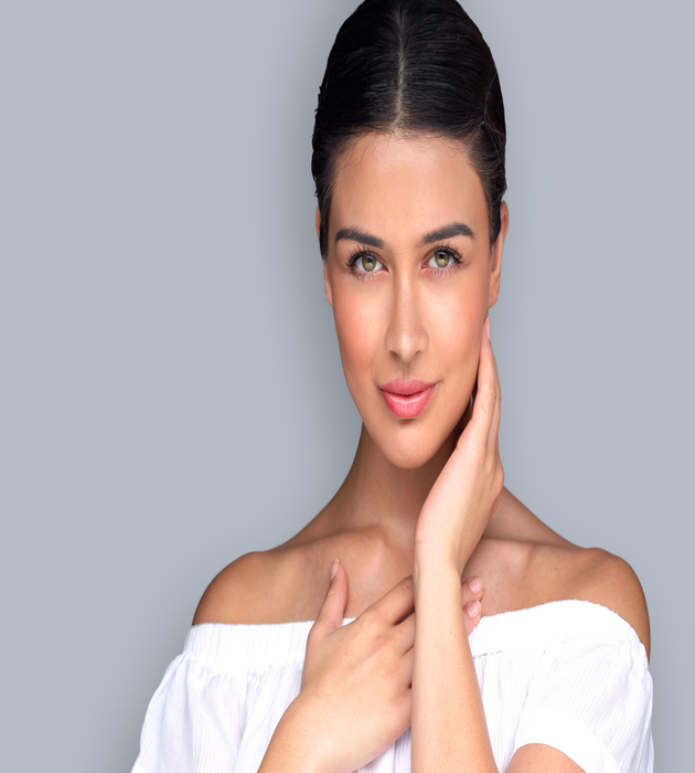 Beautiful Latina woman's face looks youthful and symmetrical