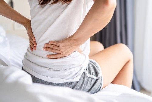 breast lift or reduction alleviate back pain